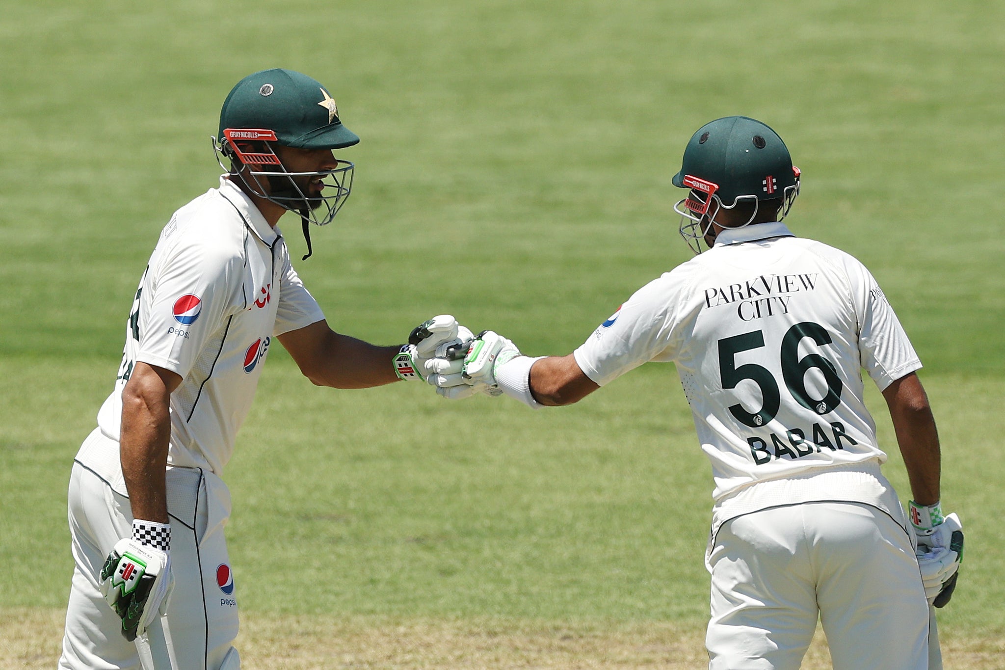 Shan celebrates with former captain Babar Azam