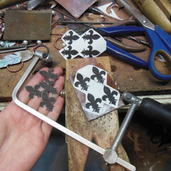 fleur de lis, jewelers bench, sawing metal