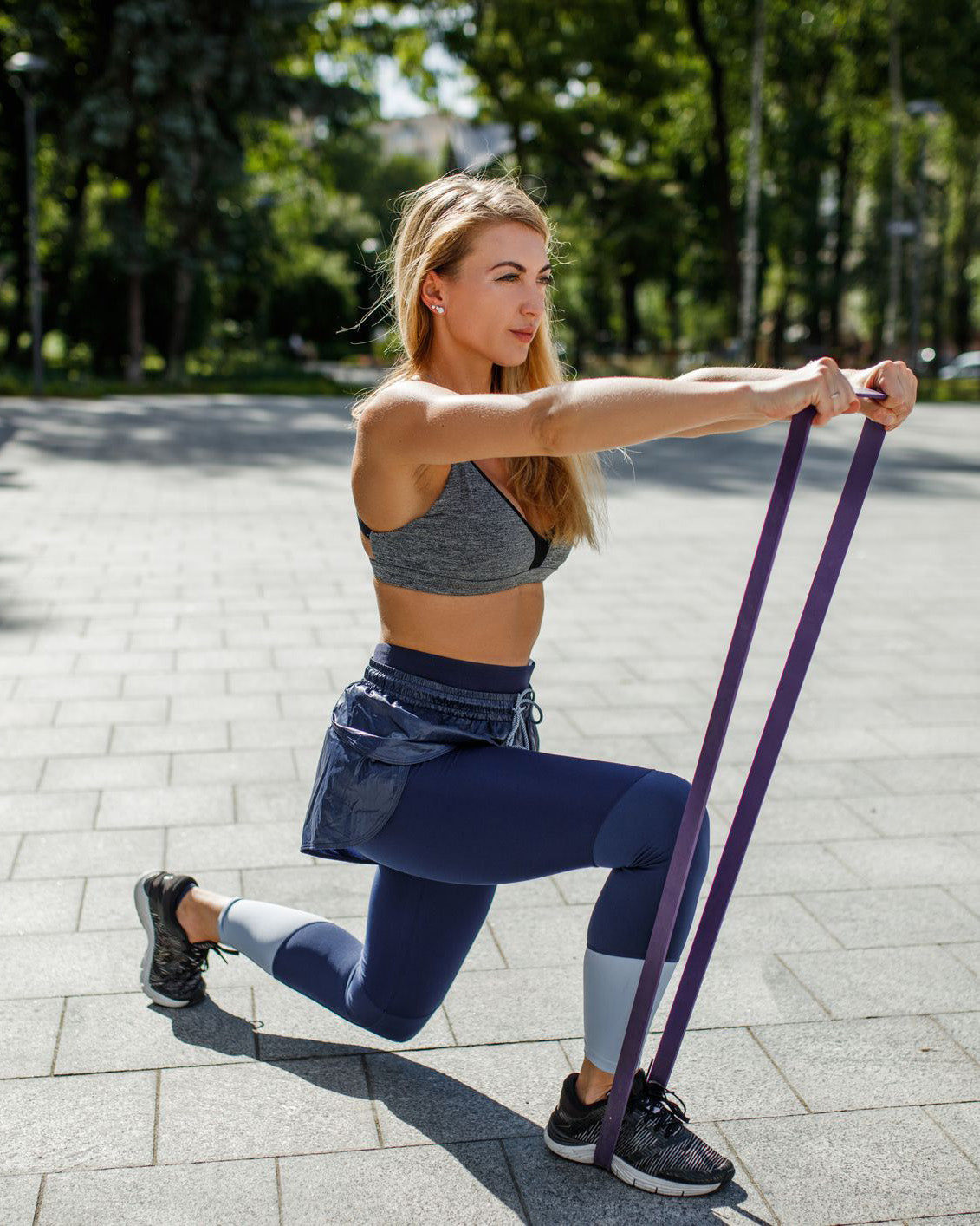 young-beautiful-woman-working-out-with-resistance-band