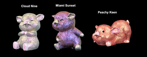 three pig models in shades of pink