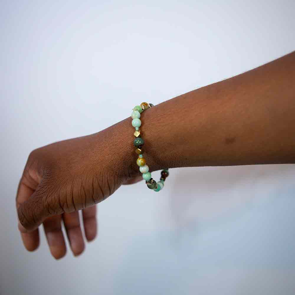 chrysoprase and hematite heart chakra bracelet modeled on wrist