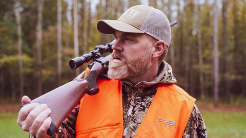 Hunter with Gun on Shoulder