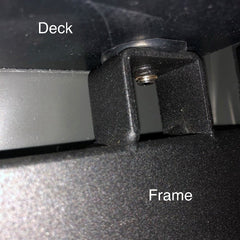 How is a treadmill deck attached to the frame