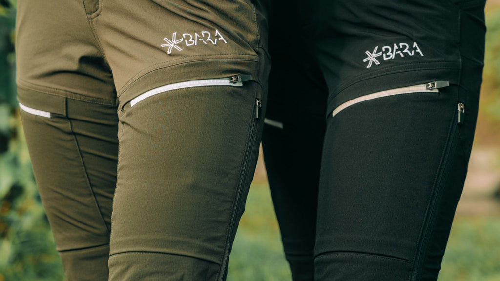 Women wearing Hiking Pants in the colours: Khaki and Black