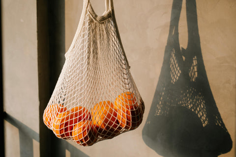 cotton net bag with oranges