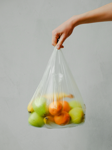 plastic grocery bag with fruits inside