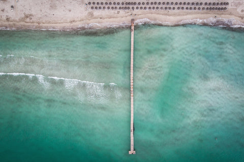 overhead wide shot of ocean and dock