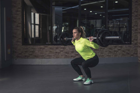 Woman's lifting wearing Sustainable Gym Wear - Guru Muscle