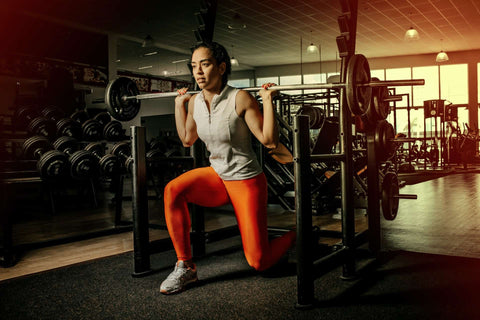 Comfortable gym wear showcased with lifting weights