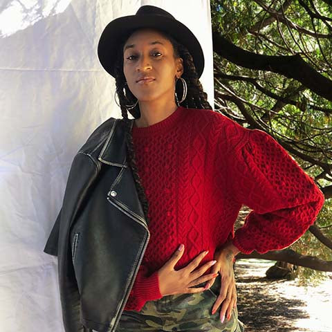 JeLisa Marshall Seattle Sustainable Stylist and Image Consultant wearing red sweater and black hat