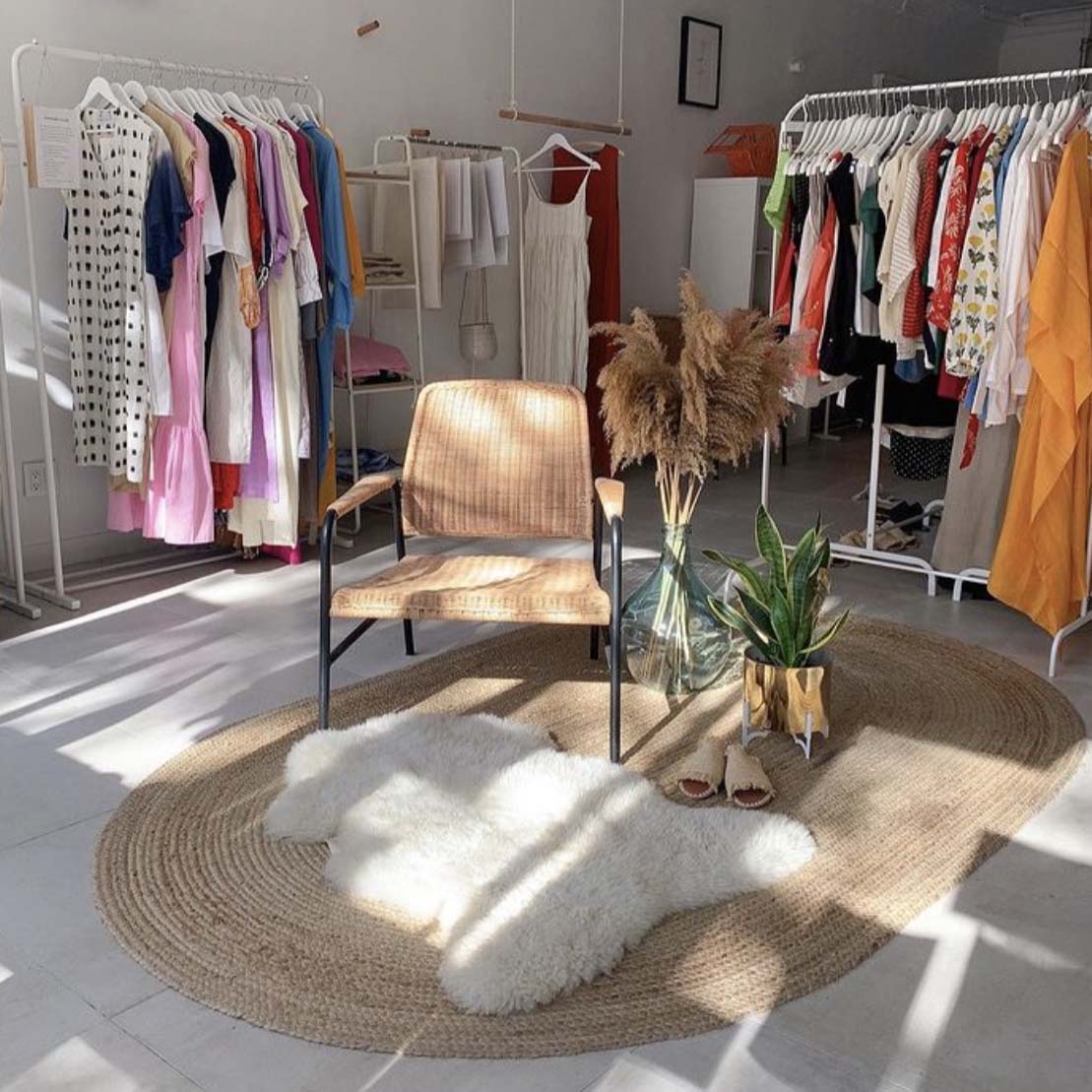 Rue St. Paul Brooklyn sustainable fashion interior shot showing clothing rack and nice chair