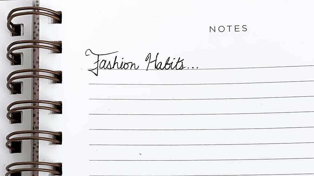 Spiral Notebook with the words "fashion habits" written in cursive