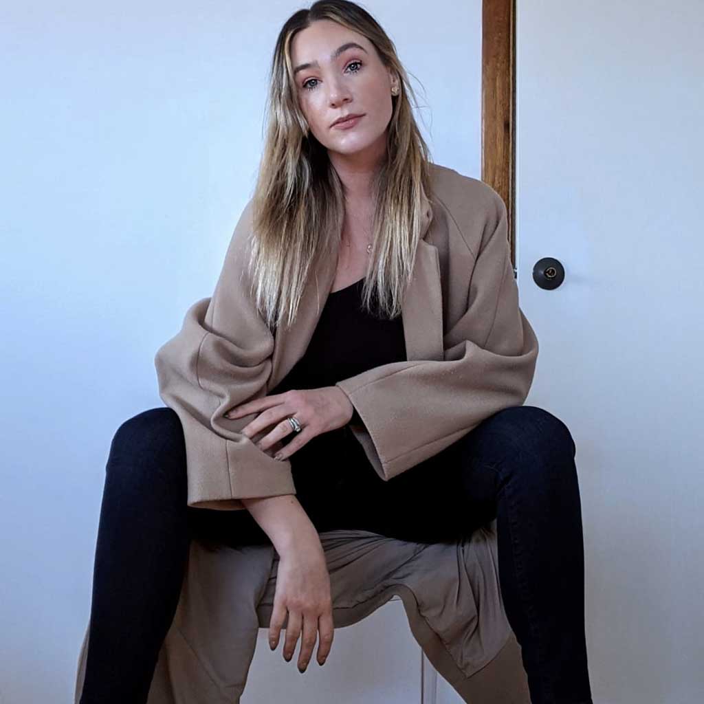 Capsule Wardrobe Coat on Wardrobe stylist Anna Dunbar. Worn over black top and pants