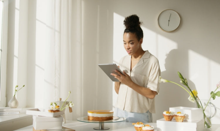 Smart Appliances photo of woman looking on tablet in kitchen
