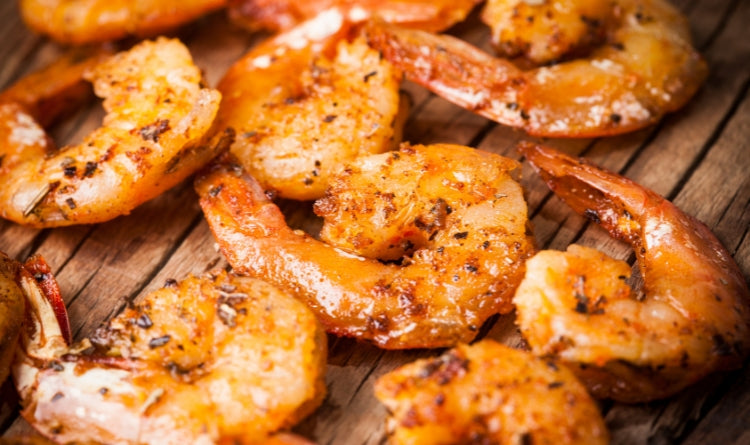 all purpose seasoning used for fish, poultry, pork, chicken, steak, fries, and more. Image showing grilled shrimp with all purpose seasoning
