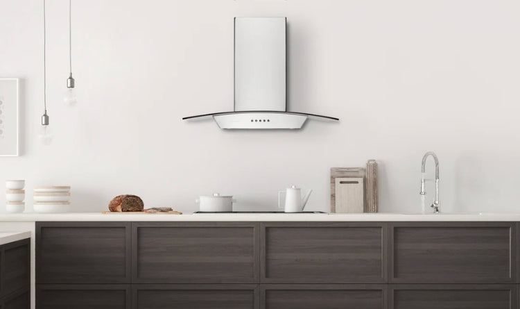 The Hauslane WM-630 wall mount range hood with a glass canopy, powerful suction, 3-speed settings, stainless steel body, and ductless operation if needed.