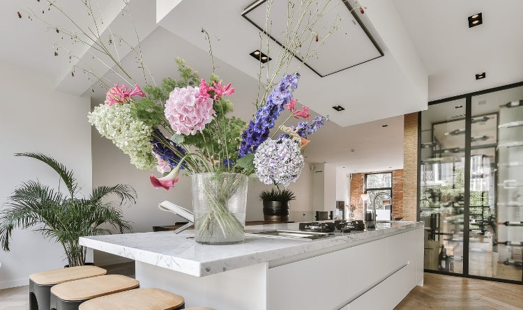 4 Innovative Ways that Charcoal can Help Your Kitchen image showing a big flower bouquet on a kitchen counter