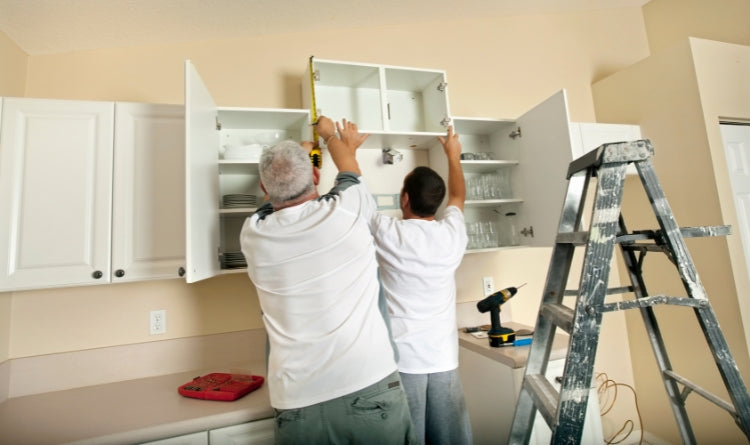 The Best Range Hood Installation: Video Guide in 7 Steps: Establish the location of where you will install your new kitchen range hood. photo showing 2 men installing a new range hood. 