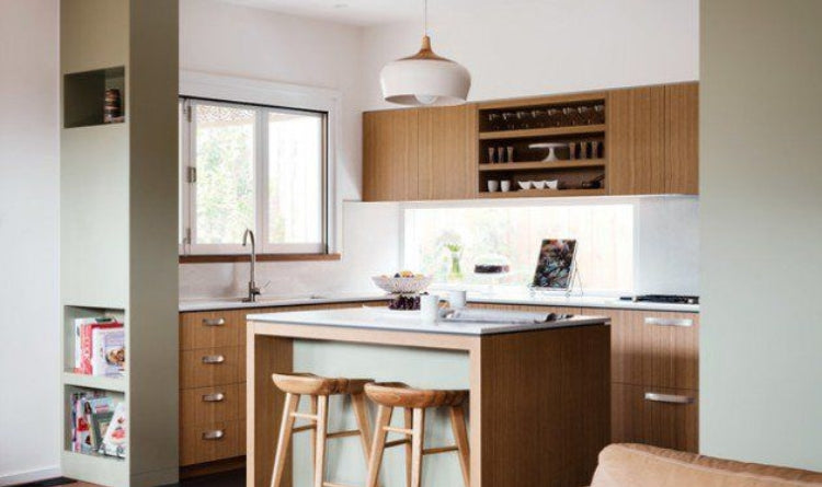 Kitchen trends 2024: earth toned kitchen using neutral browns, greens, tans, whites, and wood colors.