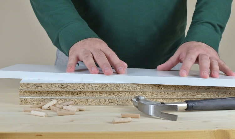 The 8 Most Common Types of Kitchen Cabinet Materials and How to Care for Them. photo showing particle board cabinets