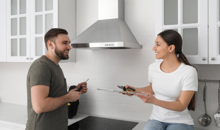The Best Range Hood Installation: Video Guide in 7 Steps: Establish the location of where you will install your new kitchen range hood. photo showing finishing up the installation process