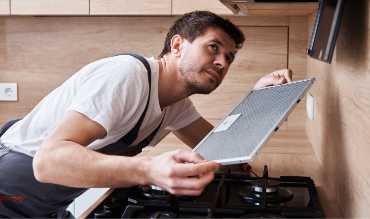 How to Install A Range Hood Vent Cover Man Gathering Tools and Materials to Install Range hood and build vent cover