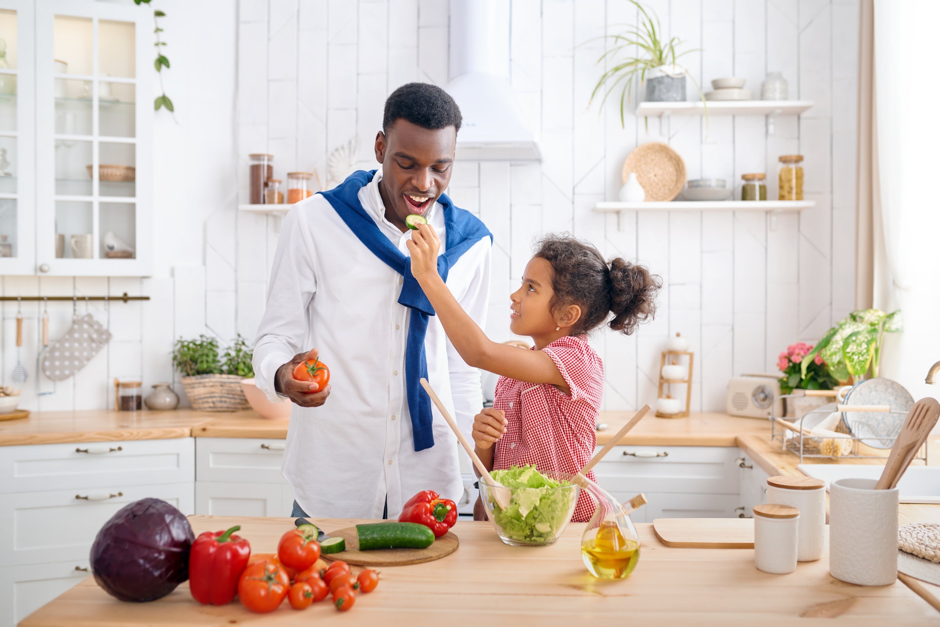 girl feeding dad fresh vegetables: 12 Simple Tips to Keep Your Produce Fresh for Longer