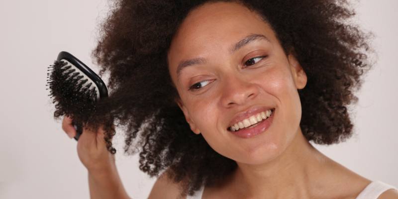 A Woman Detangling Her Hair