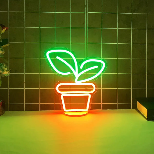 Neon sign of a potted plant with two green leaves on a dark grid-patterned background.