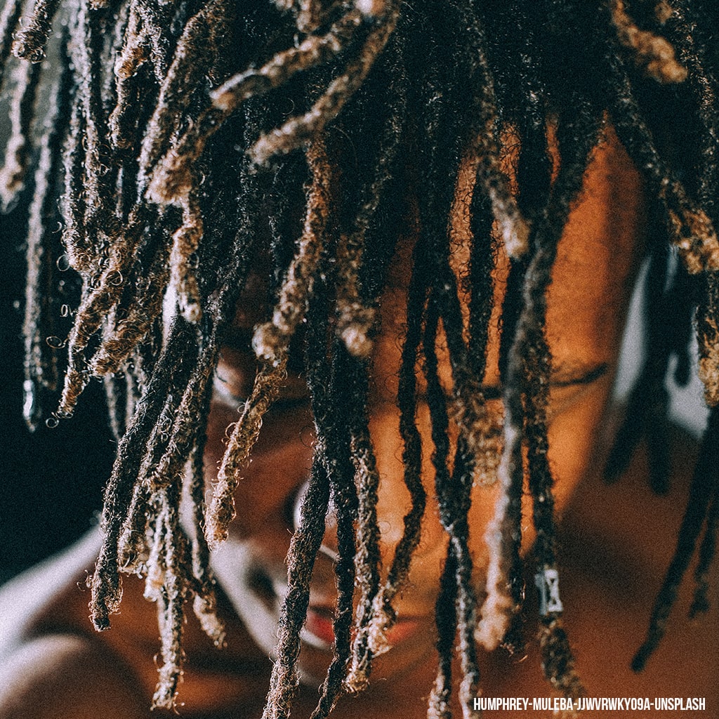 African American Man Head Down Wearing Dreadlocks