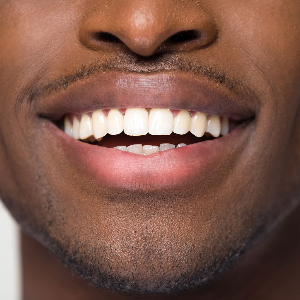 African black man with healthy straight clean teeth