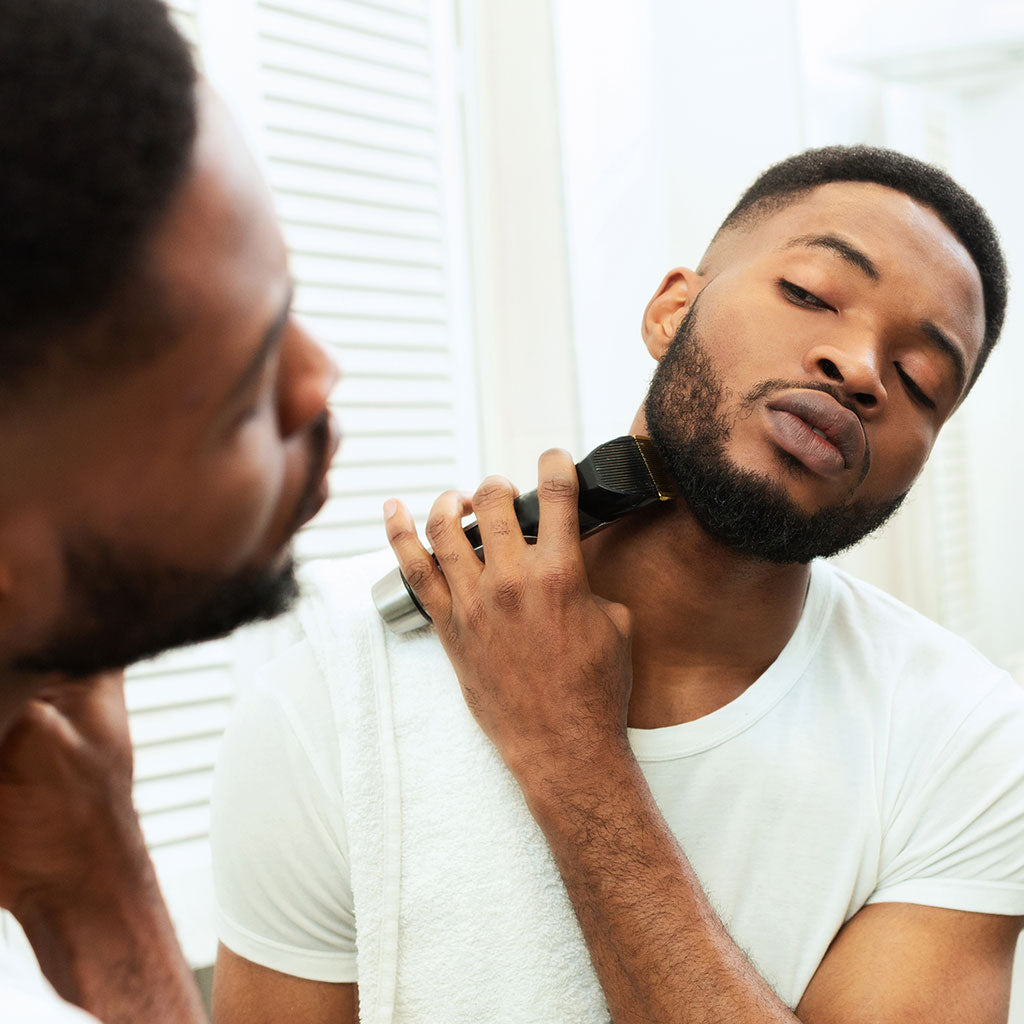 Man Trimming His Beard First Before Shaving
