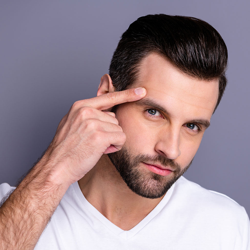 Man Pointing At Eyebrow Hair