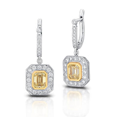 15901 Platinum drop earrings featuring 2.65 total carats of emerald cut fancy intense yellow diamonds with VVS1-VS1 clarity and 1.05 total carats of round brilliant cut diamonds.