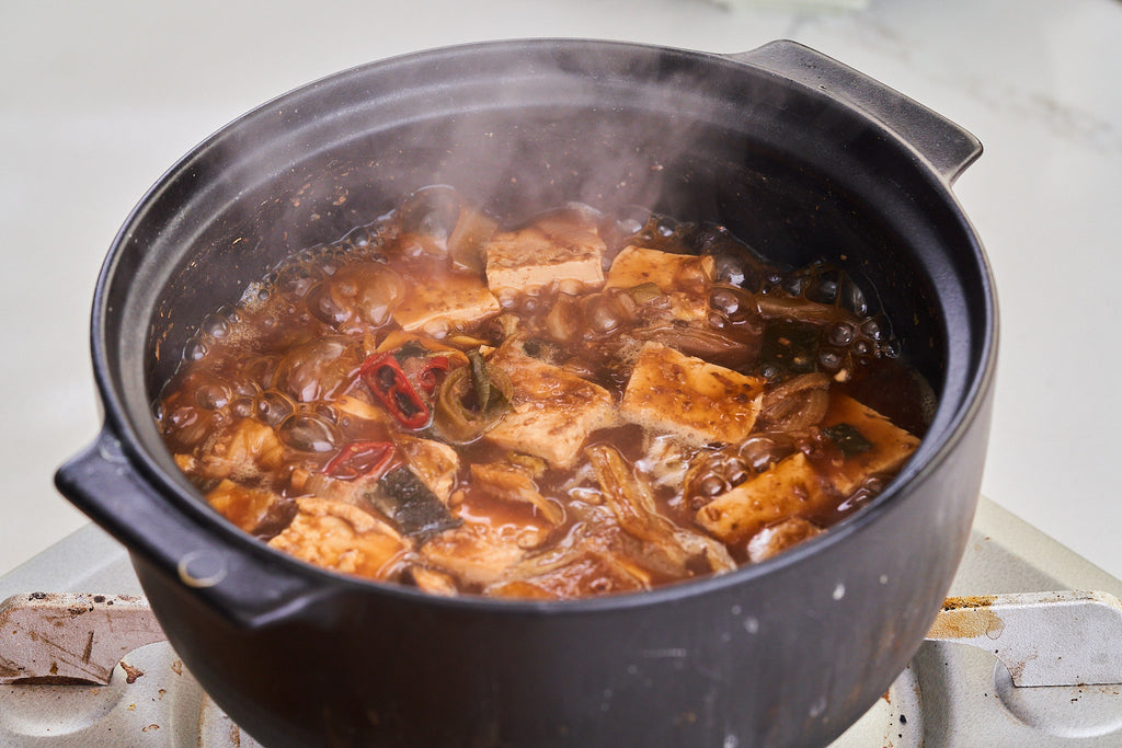 A steaming pot of doenjang jjigae