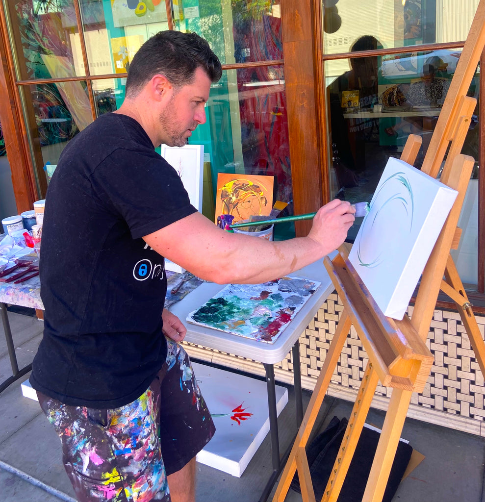 Michael Carini painting demos for ArtWalk