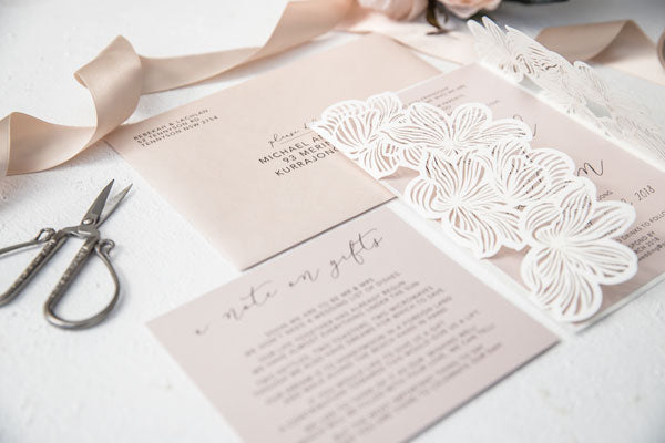 ivory laser-cut wedding invitation