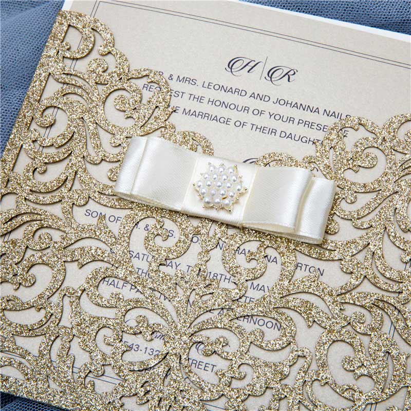 laser-cut pocket ivory and gold invitation