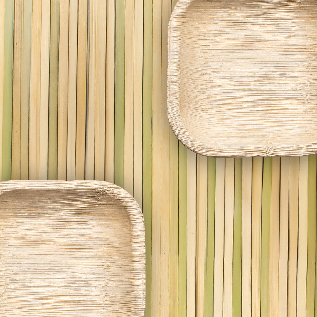 Square plates made of palm leaves, highlighting sustainable dining options with natural textures and earth-friendly materials.