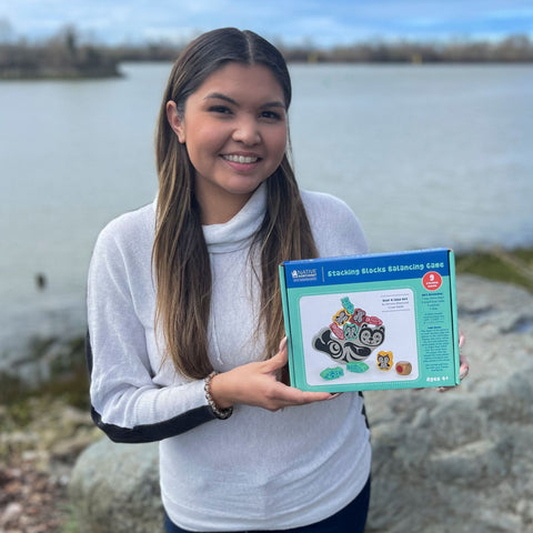 simone diamond indigenous artist holding balancing games for kids