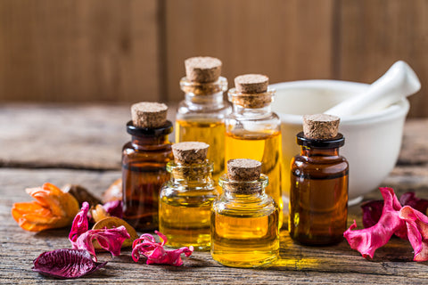 some essential oils in the glass bottles as an answer to what is aromatherapy massage question