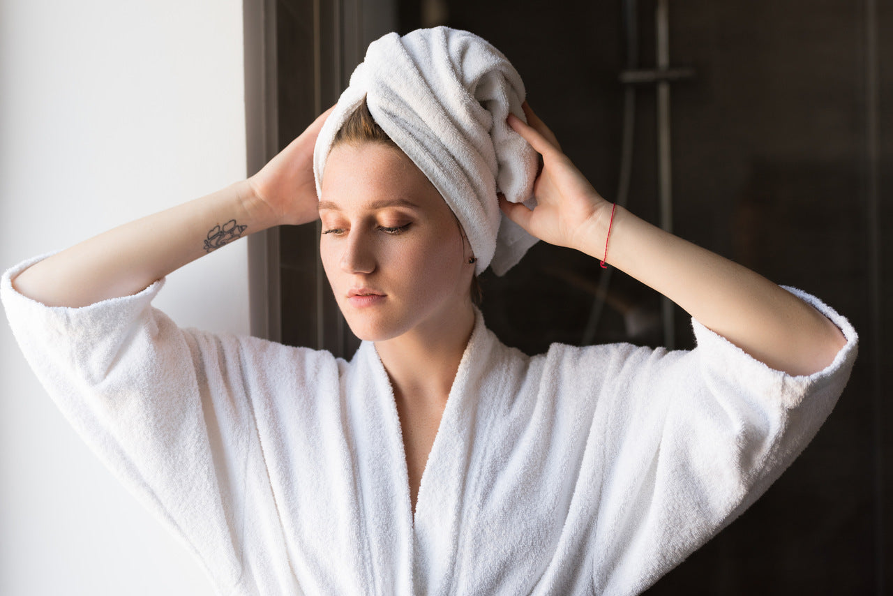 woman with a white towel wrapped around her head