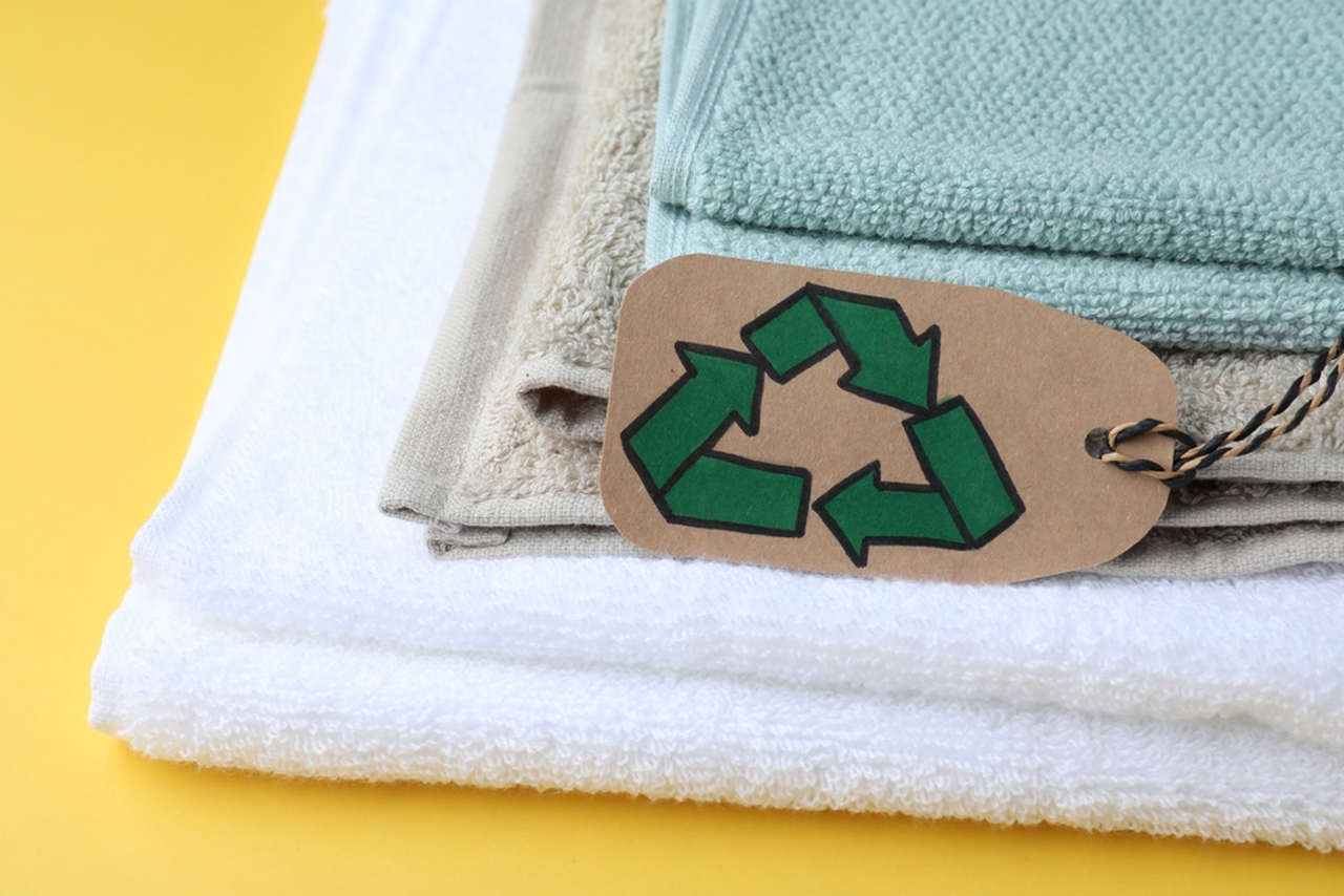 different colored towels with recycle sign on them