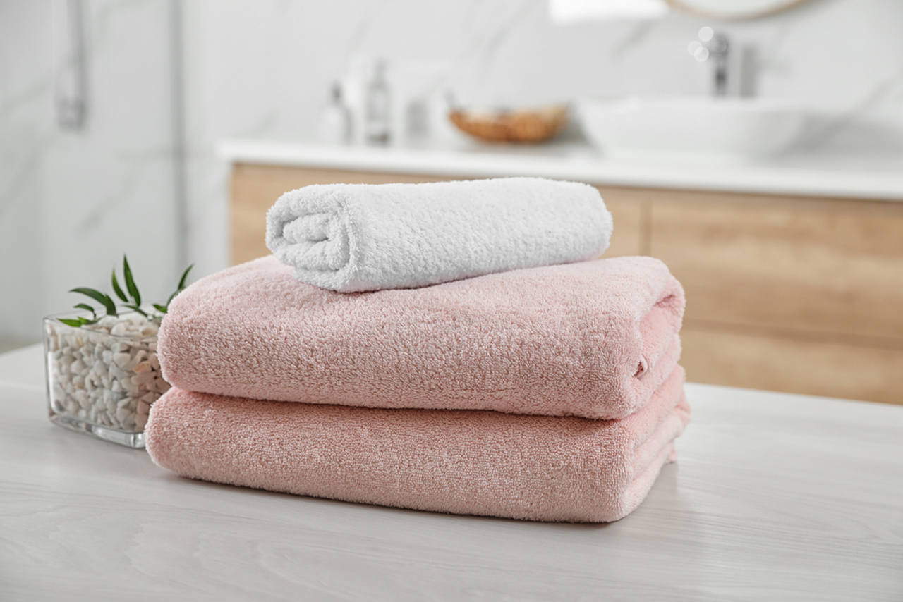 white and pink bath towels