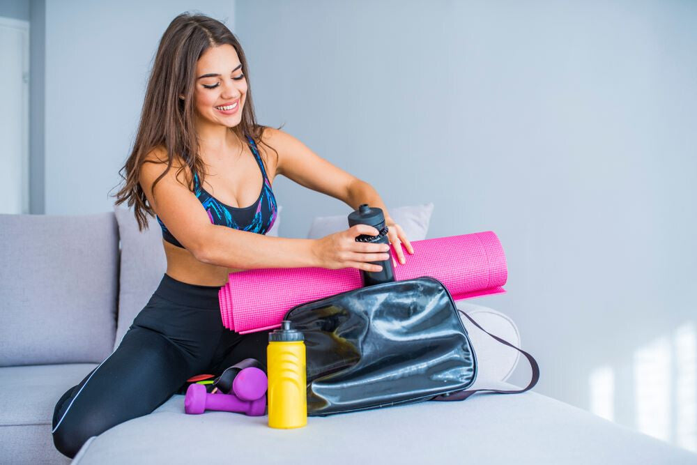 woman packing a gym bag