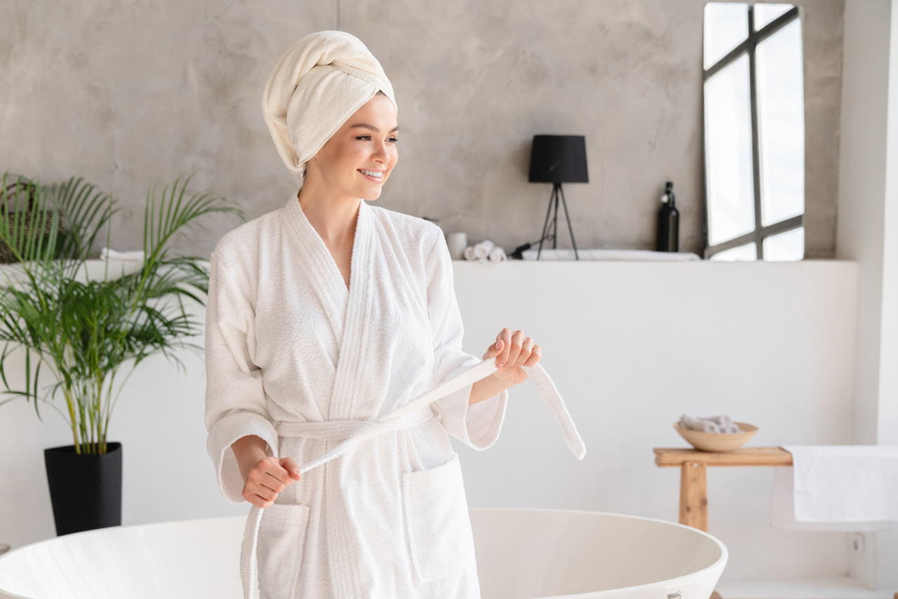 woman wearing a white comfortable bathrobe