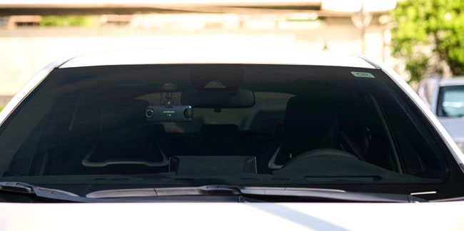 Black-tint-shield-on-the-windshield-of-the-car.jpg