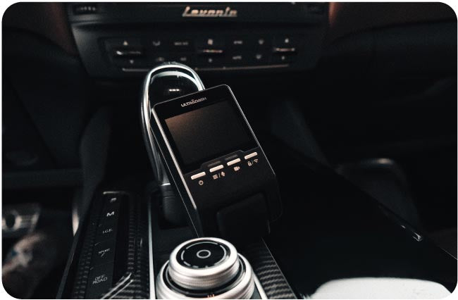 ultradash dash cam in a maserati dashboard with its Gear shift lever