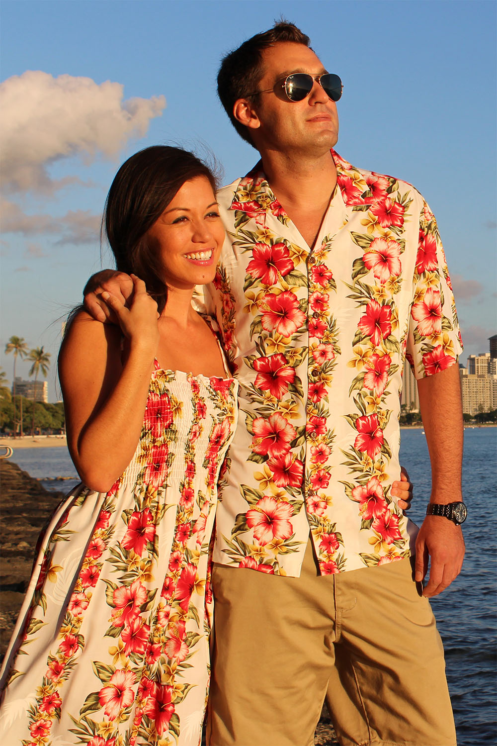 catching a sunset in matching Aloha Mood Hawaiian dress and shirt