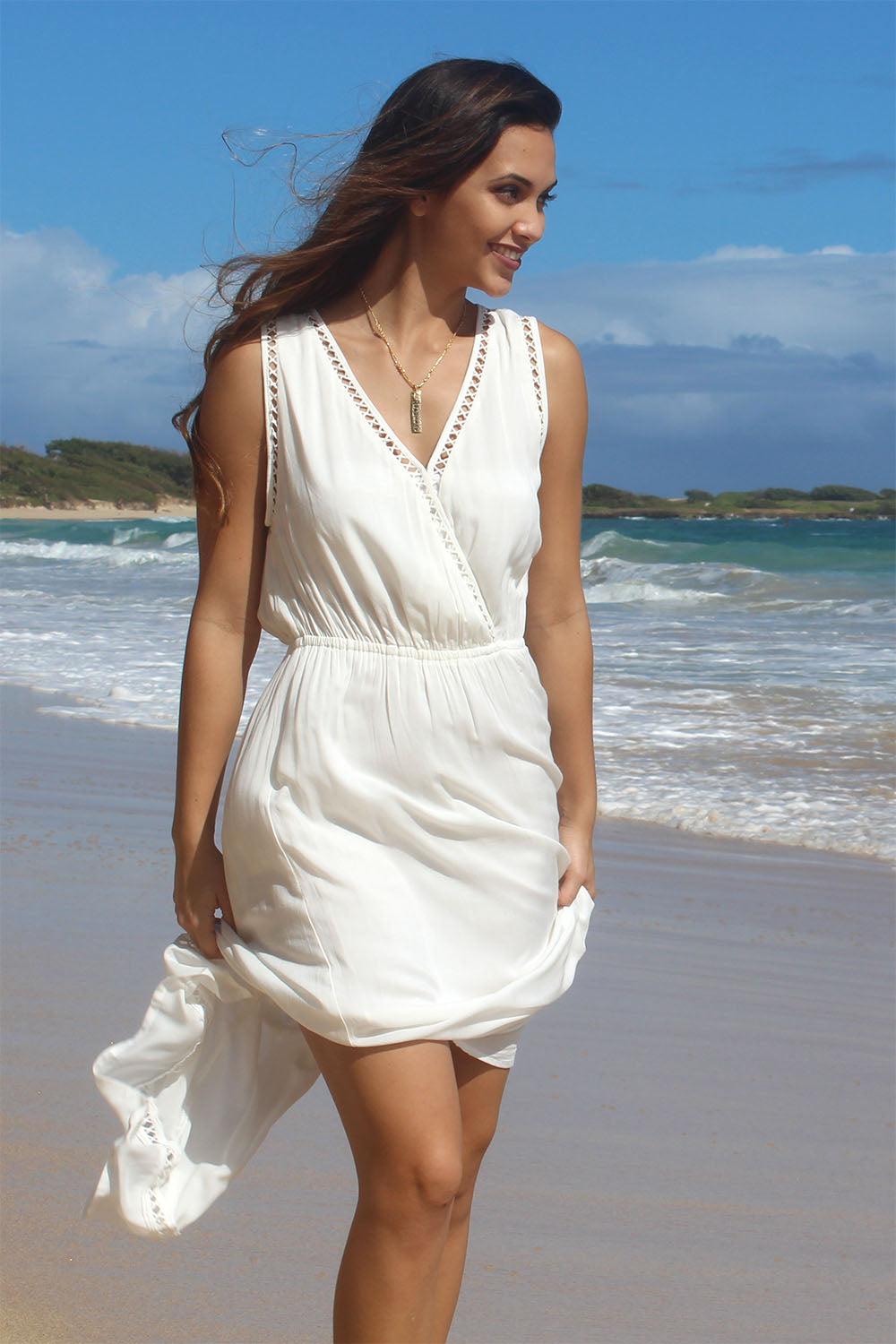 Jaqlyn taking a walk on the beach in a while Nahele dress by Angels by the Sea